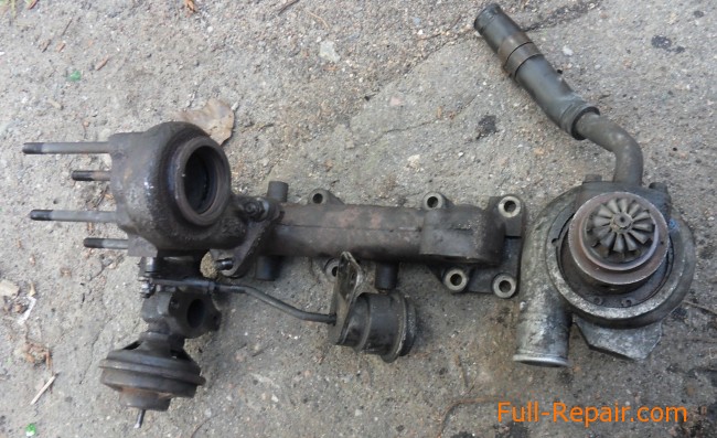 Клапан EGR на двигателе CRDI. Выпускной коллектор снят Клапан EGR на двигателе CRDI. Выпускной коллектор снят